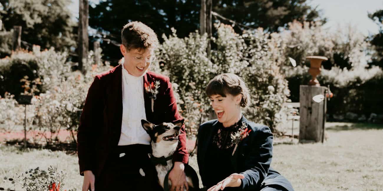 Couple sits with their dog in the sun how to elope Intimate Wedding ceremony Melbourne Let's Elope Melbourne Celebrant Photographer Elopement Package Victoria Sarah Matler Photography Acre of Roses weddings intimate
