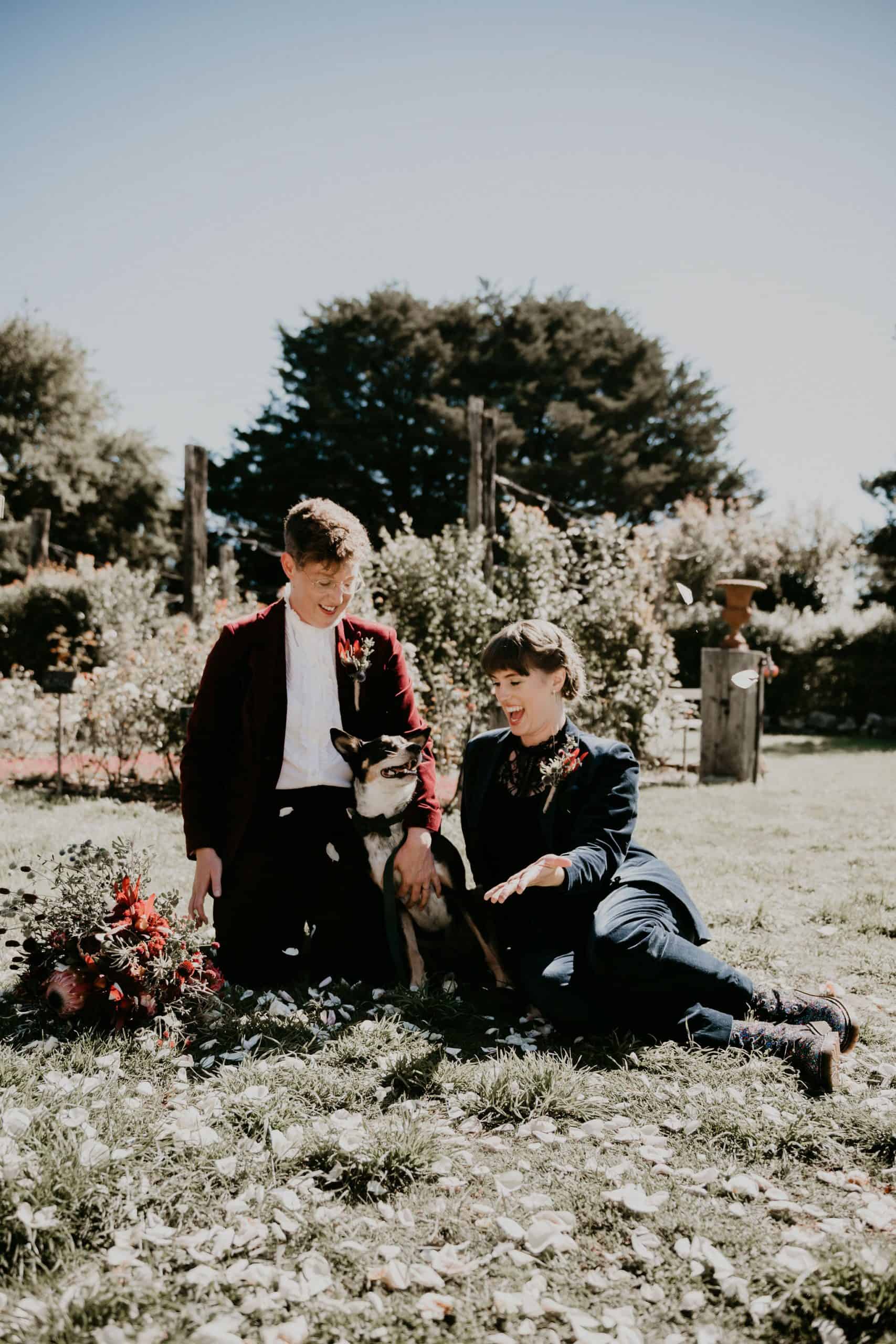 Couple sits with their dog in the sun how to elope Intimate Wedding ceremony Melbourne Let's Elope Melbourne Celebrant Photographer Elopement Package Victoria Sarah Matler Photography Acre of Roses weddings intimate