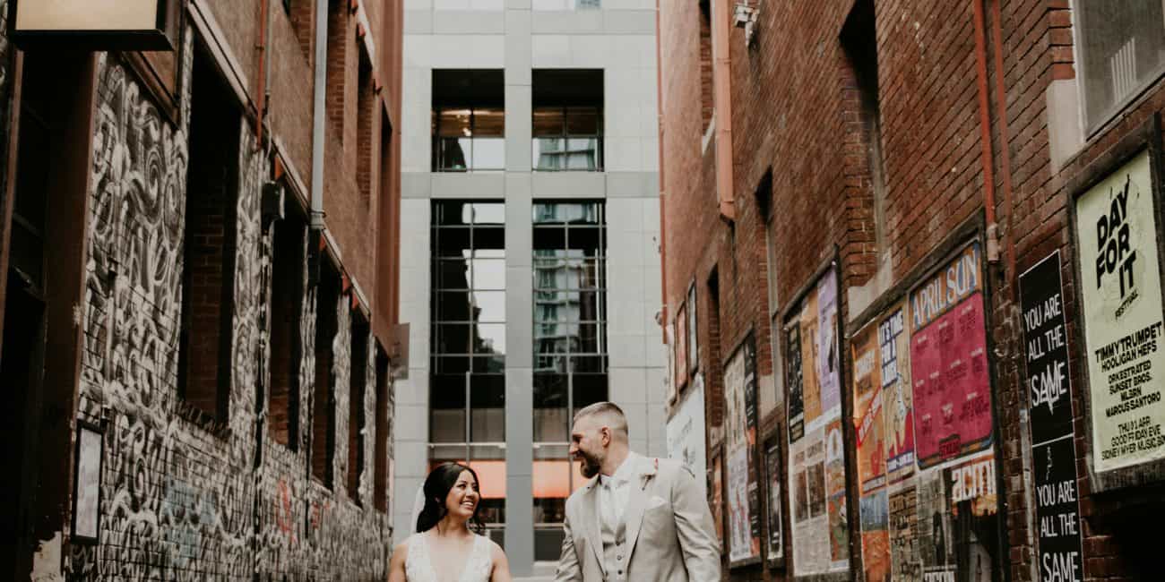 Couple Walks down ACDC Lane how to elope Intimate Wedding Melbourne Lets Elope Melbourne Celebrant Photographer Elopement Package Victoria Sarah Matler Photography Fitzroy Gardens Melbourne Laneways weddings intimate