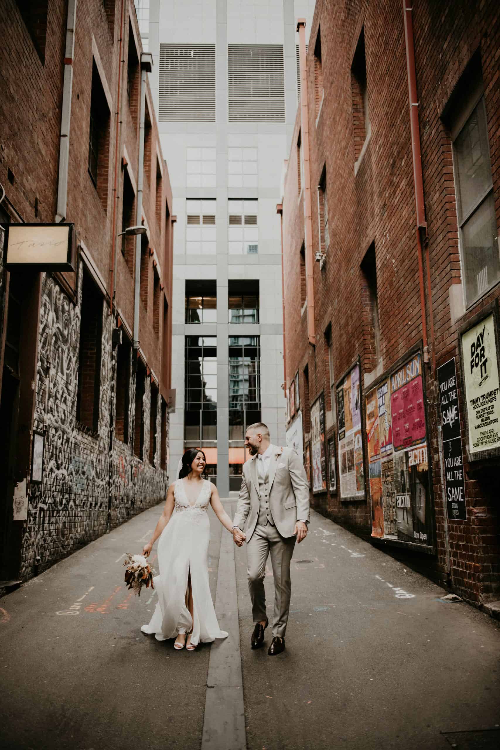 Couple Walks down ACDC Lane how to elope Intimate Wedding Melbourne Lets Elope Melbourne Celebrant Photographer Elopement Package Victoria Sarah Matler Photography Fitzroy Gardens Melbourne Laneways weddings intimate