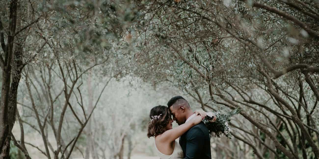 Couple hugs under olive grove Lavandula Swiss Italian Farm Daylesford Elopement with Let's Elope Melbourne Celebrant Photographer Elopement Package Victoria Sarah Matler Photography Macedon Ranges intimate wedding ceremony