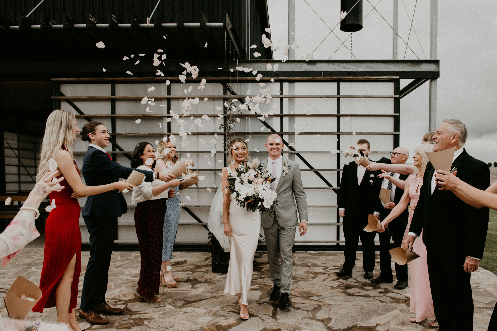 Throwing petals as couple exit ceremony Let's Elope Melbourne Celebrant beautiful ceremony and photography Elopement Packages Victoria Sarah Matler Photography Zonzo Estate Yarra Valley Winery Intimate Wedding Photos